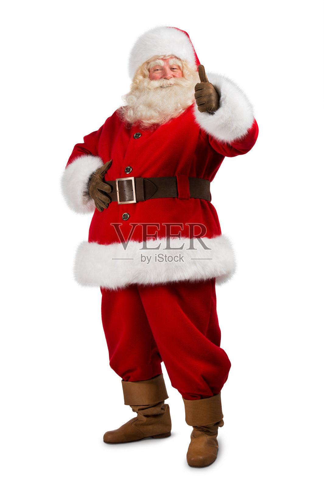 圣诞老人孤立地站在白色背景上，竖起大拇指照片摄影图片