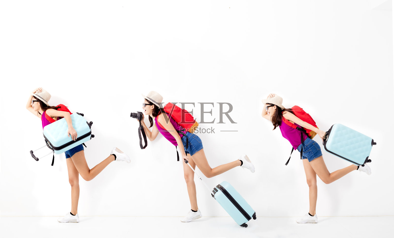 快乐的年轻女人拿着行李箱，跑着去旅行照片摄影图片