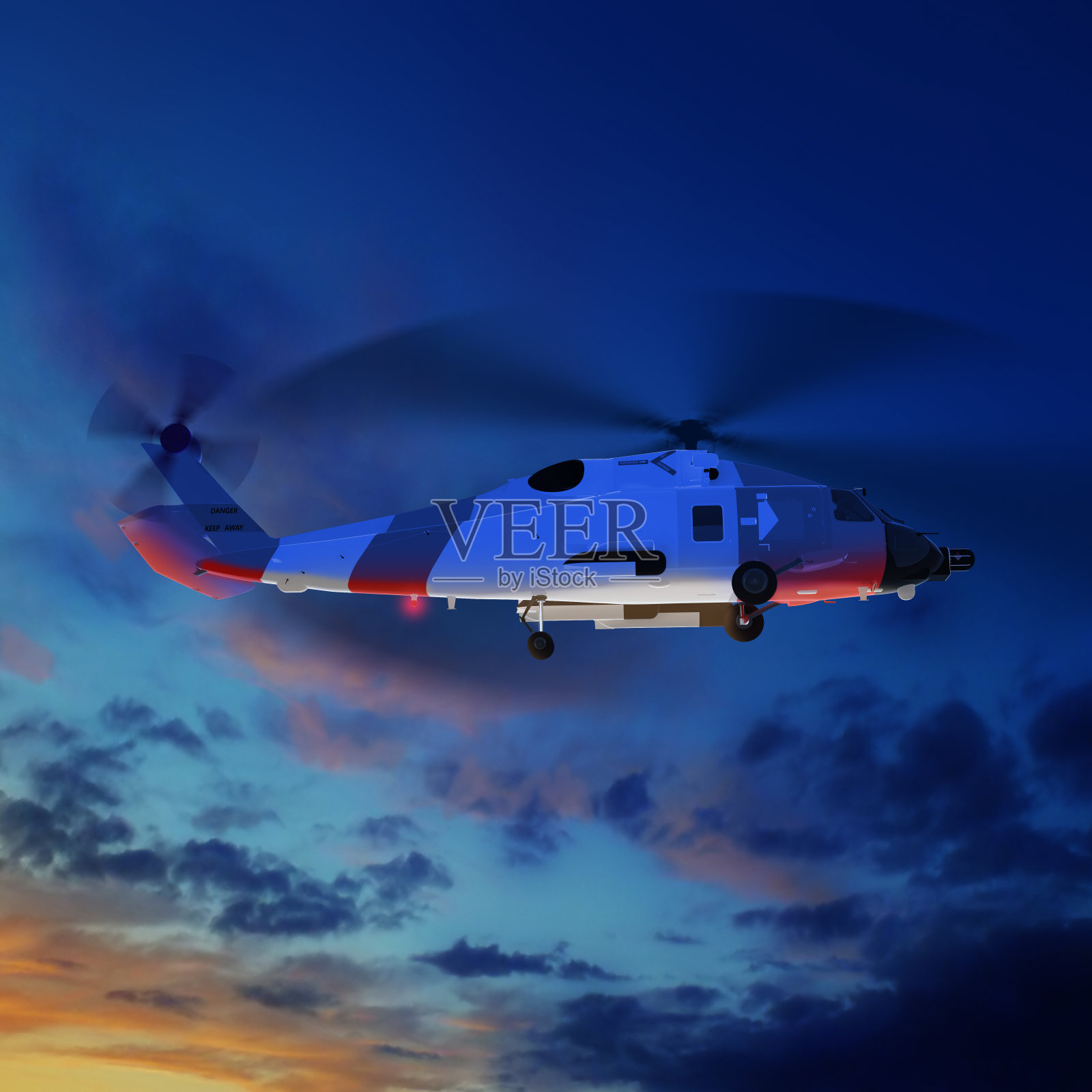 海岸警卫队直升机在蓝色的日落天空。照片摄影图片