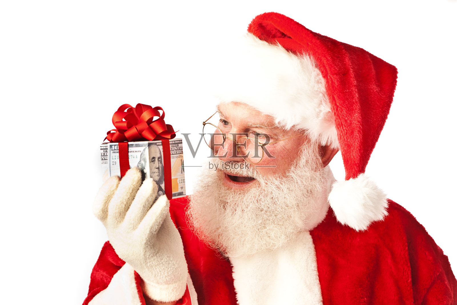 圣诞老人与圣诞现金钱礼物在白色的背景照片摄影图片