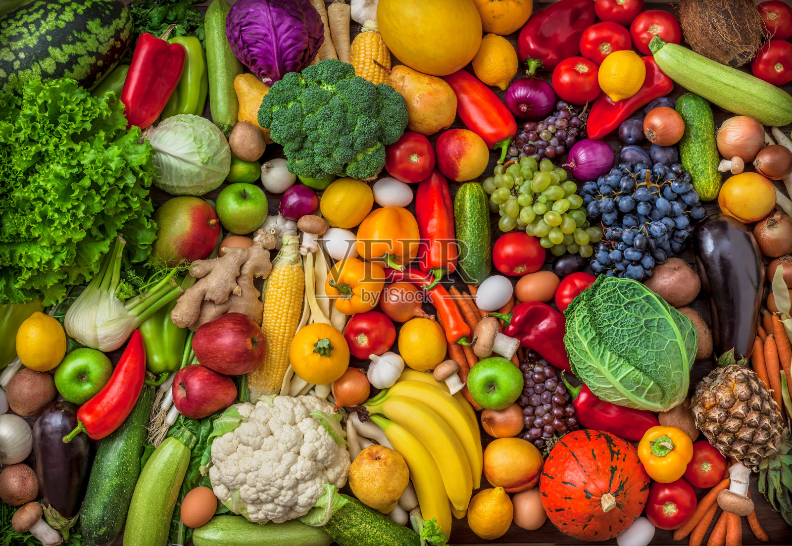 蔬菜和水果大的头顶混合组在彩色的背景照片摄影图片