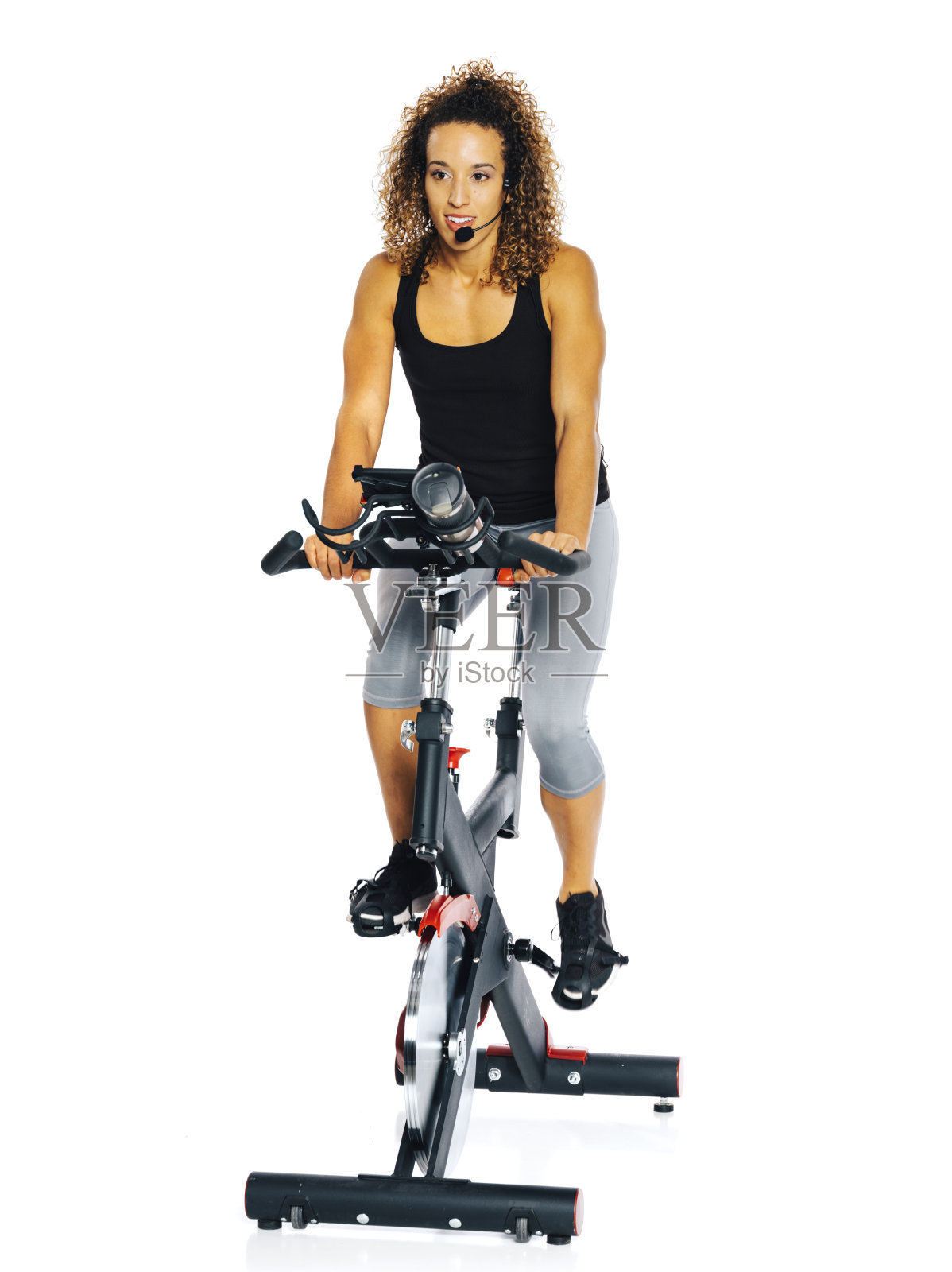 骑健身自行车的女人照片摄影图片