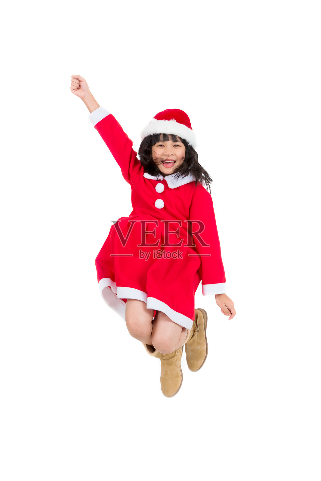 穿着圣诞老人服装的小女孩的肖像，圣诞节的概念照片摄影图片
