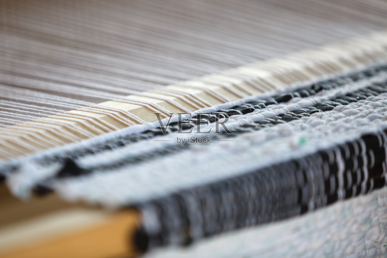木质织布机是一种手工织物制造设备。特写镜头照片摄影图片