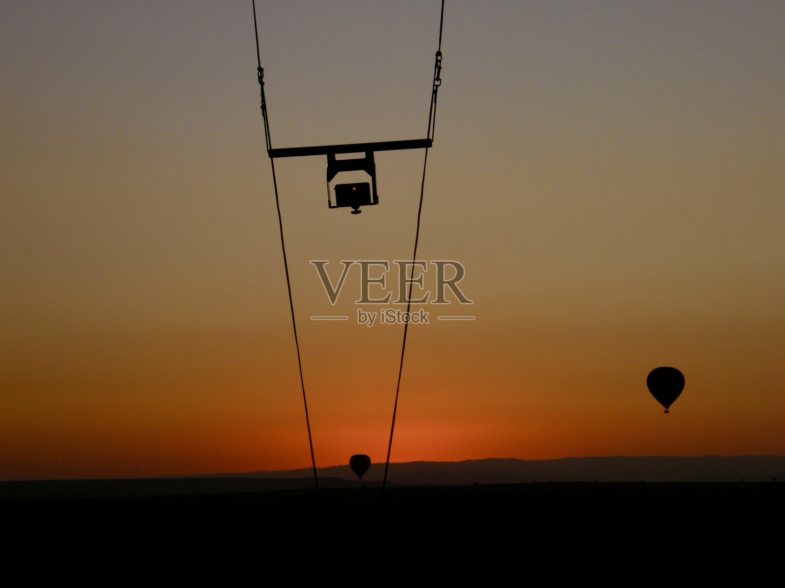 日出时的热气球照片摄影图片