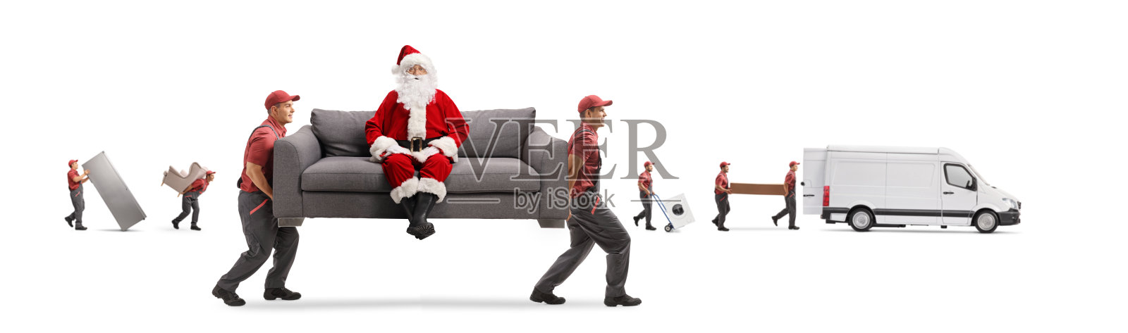 圣诞老人坐在沙发上，由两个工人和其他搬运工搬运货车照片摄影图片