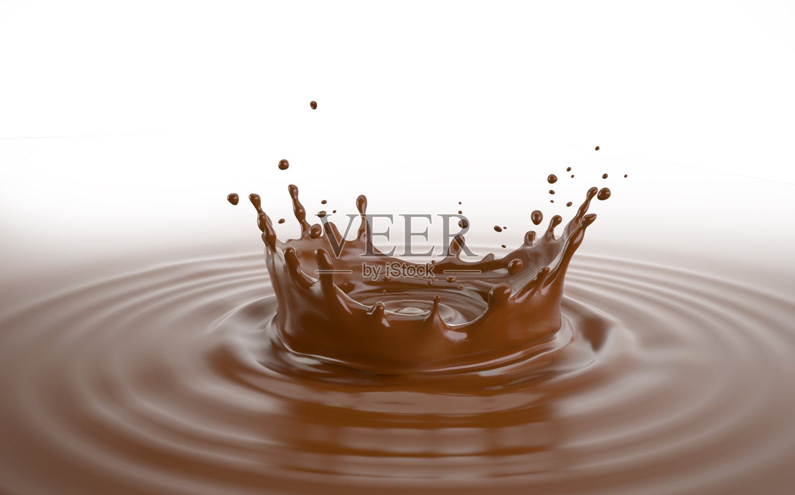 液体巧克力皇冠飞溅池。照片摄影图片