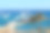 埃及赫尔加达红海度假胜地的游艇、带遮阳板和躺椅的海滩素材图片