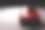 新的红色金属轿车轿车在聚光灯下。现代设计,brandless。素材图片